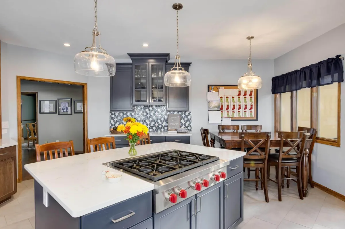 Falcon Hills Project main photo — Chef-inspired kitchen with two-tone cabinetry, glass mosaic backsplash, and professional appliance integration.