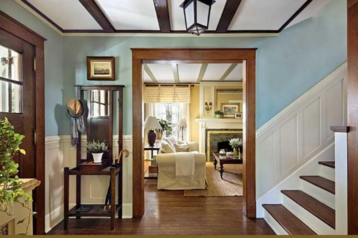 Custom staircase with stained handrails and iron balusters by CTC Design & Renovation