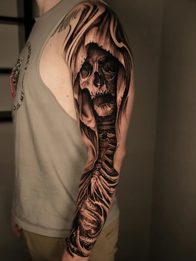 Black and grey grim reaper sleeve tattoo by James Strickland at Montana Tattoo Company in Missoula Montana