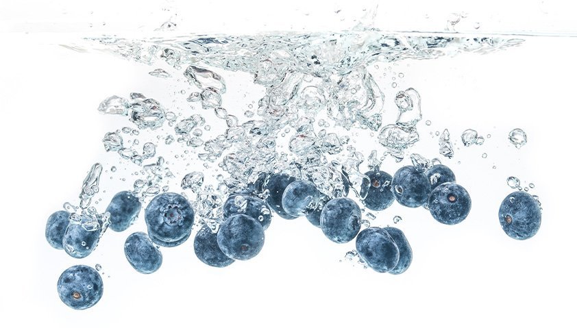 Fresh produce being rinsed with water