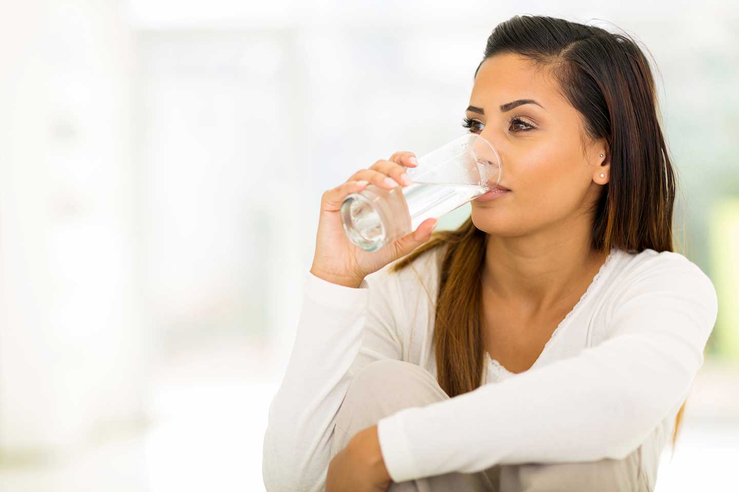 Woman drinking a glass of water