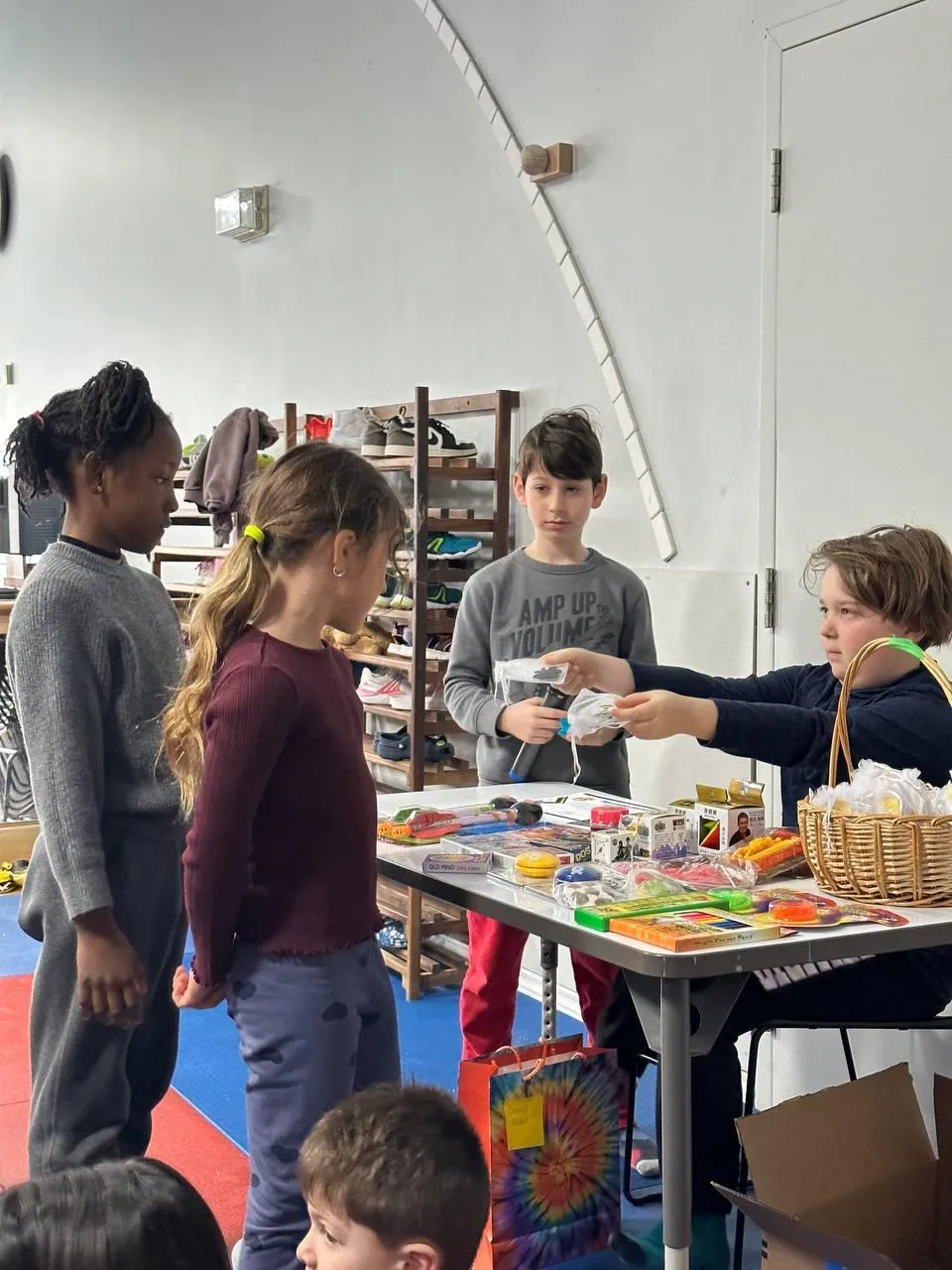 Children collaborating on a student-run display at Evergreen