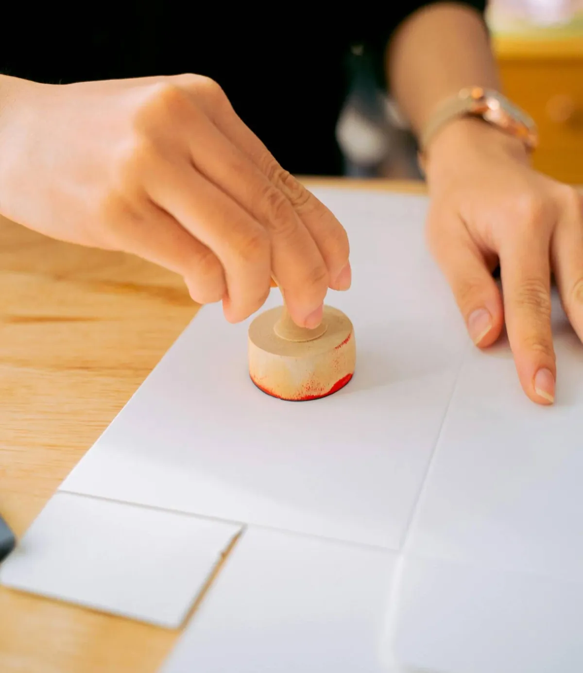 An official document being carefully stamped