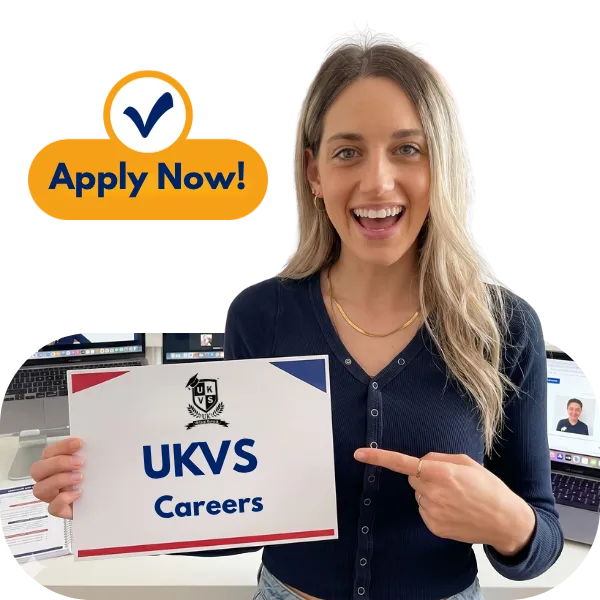 Teacher Andromachi holding a UKVS Careers sign