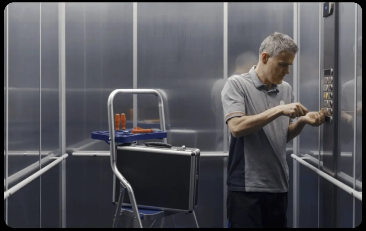 Faraday Elevator maintenance technician working inside an elevator