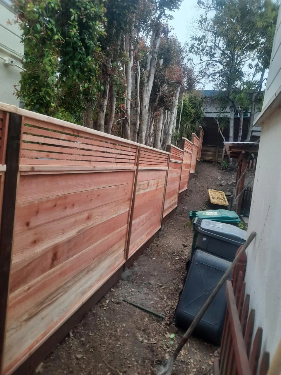 Backyard wood fence installed by Hermanos Fence in the Bay Area