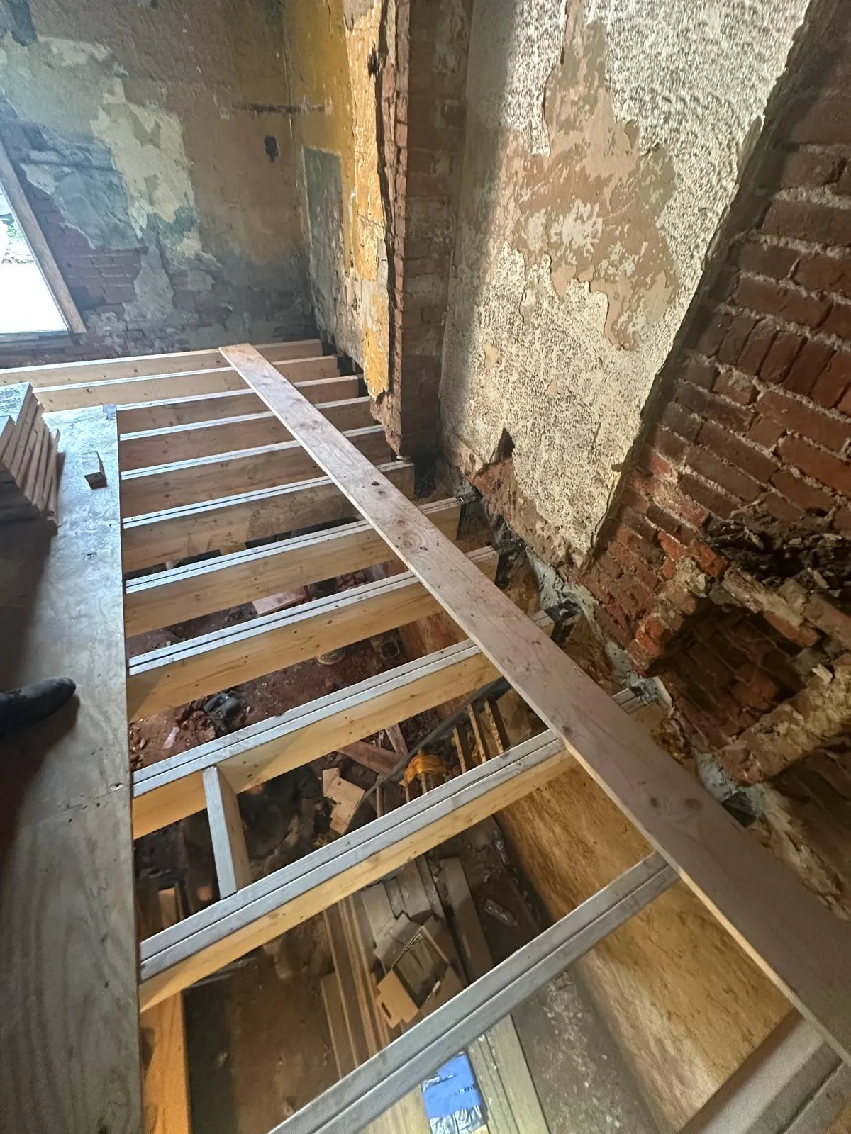 Structural floor framing exposed during an older home repair