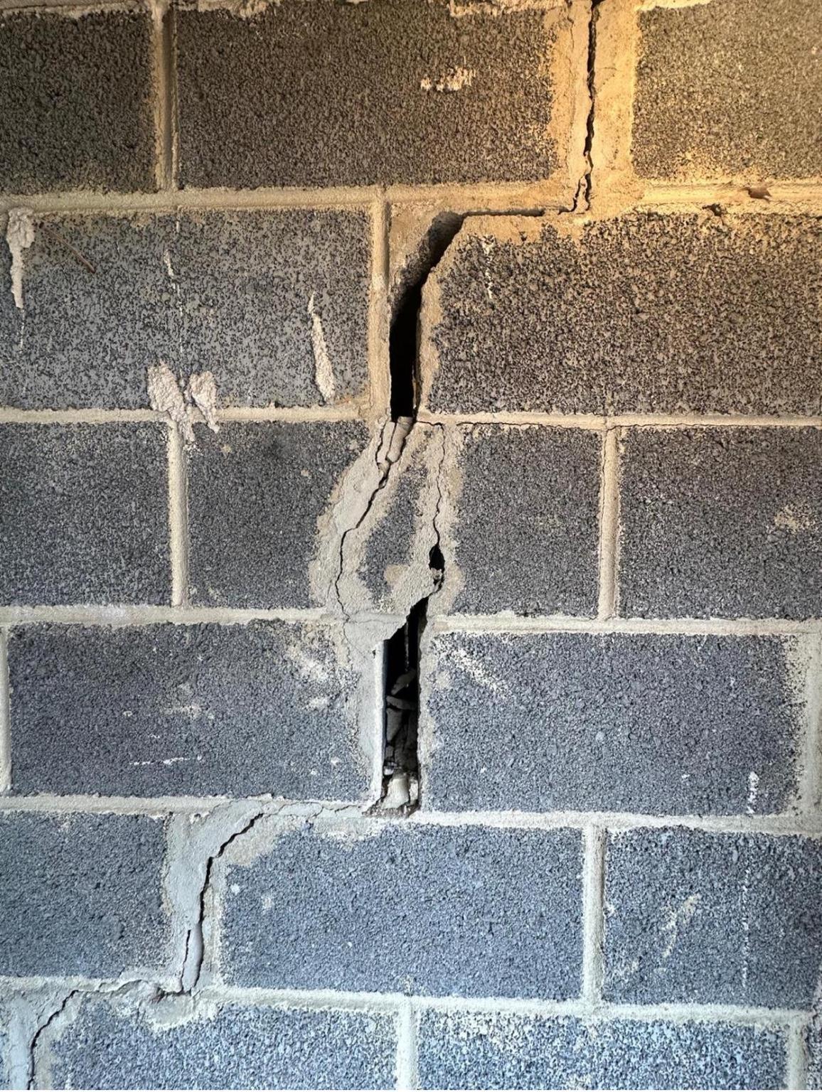 Cracked block wall showing a warning sign of structural movement