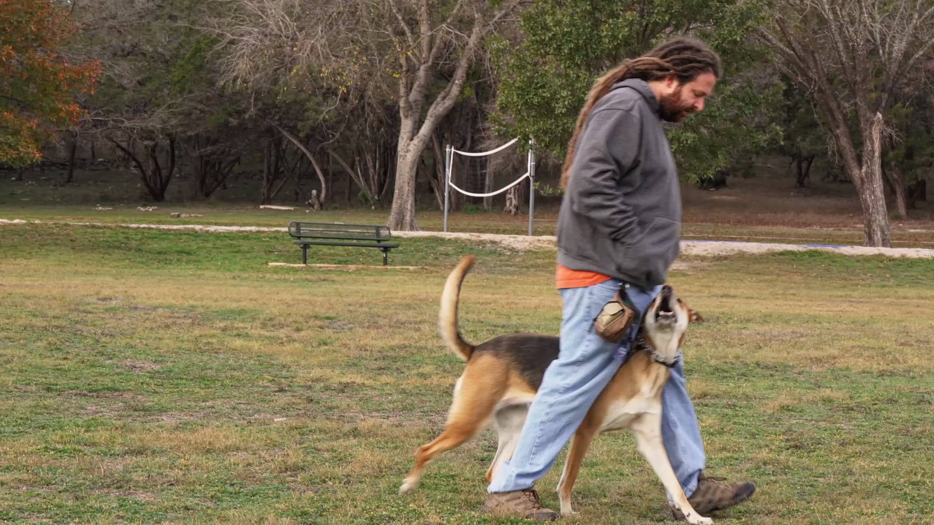 Hill Country K9 trainer walking with a dog during real-world obedience training in Greater Austin
