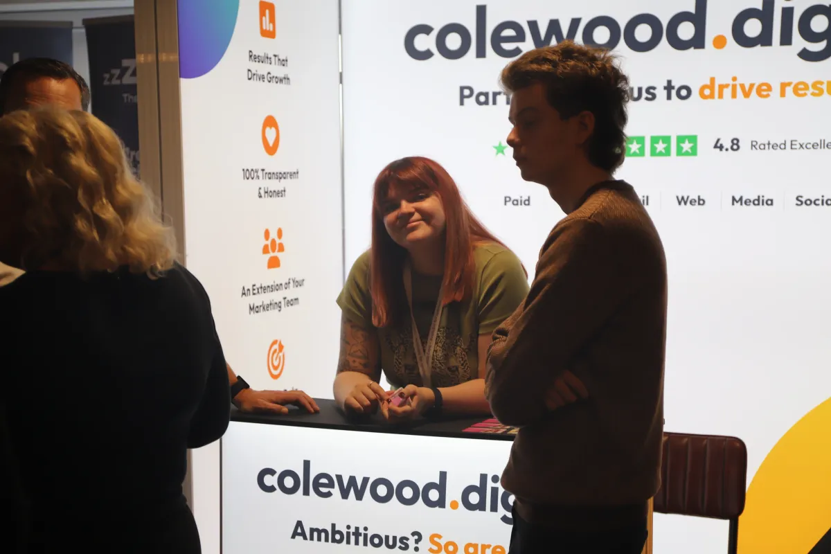 Visitors speaking with exhibitors at a previous Tees Expo business event