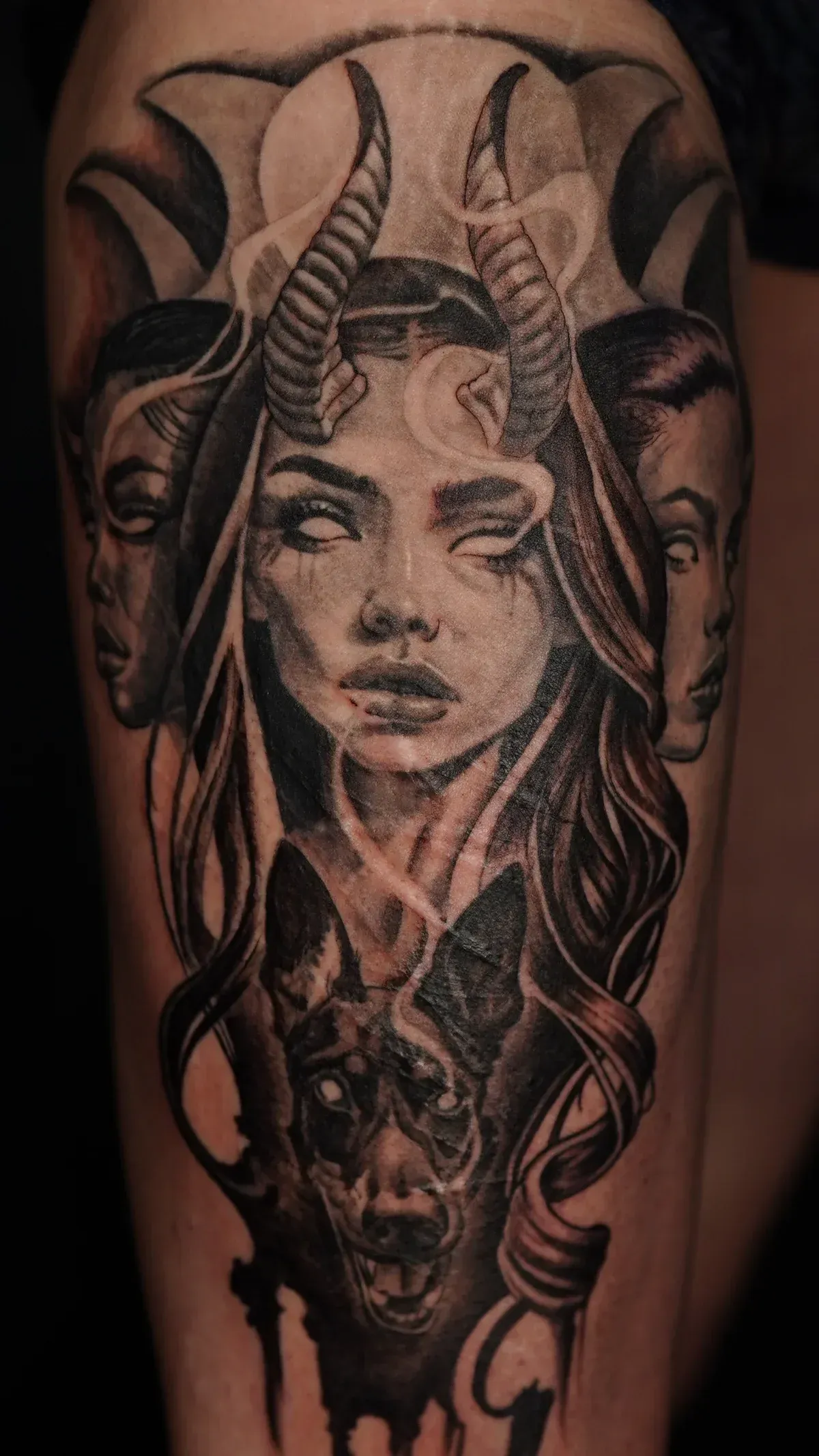 Black and grey surreal demon portrait tattoo by Mickey Schlick at Montana Tattoo Company in Missoula Montana