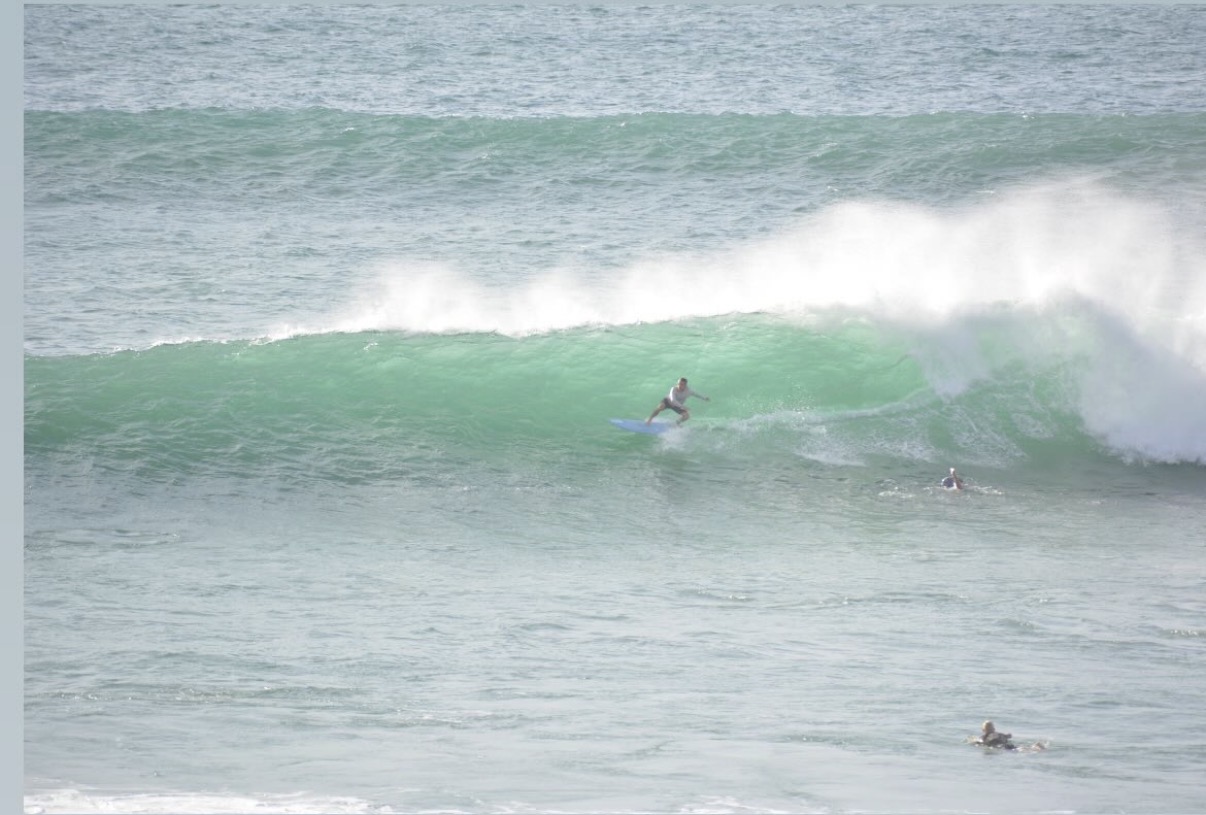 Surfer riding a wave in San José del Cabo
