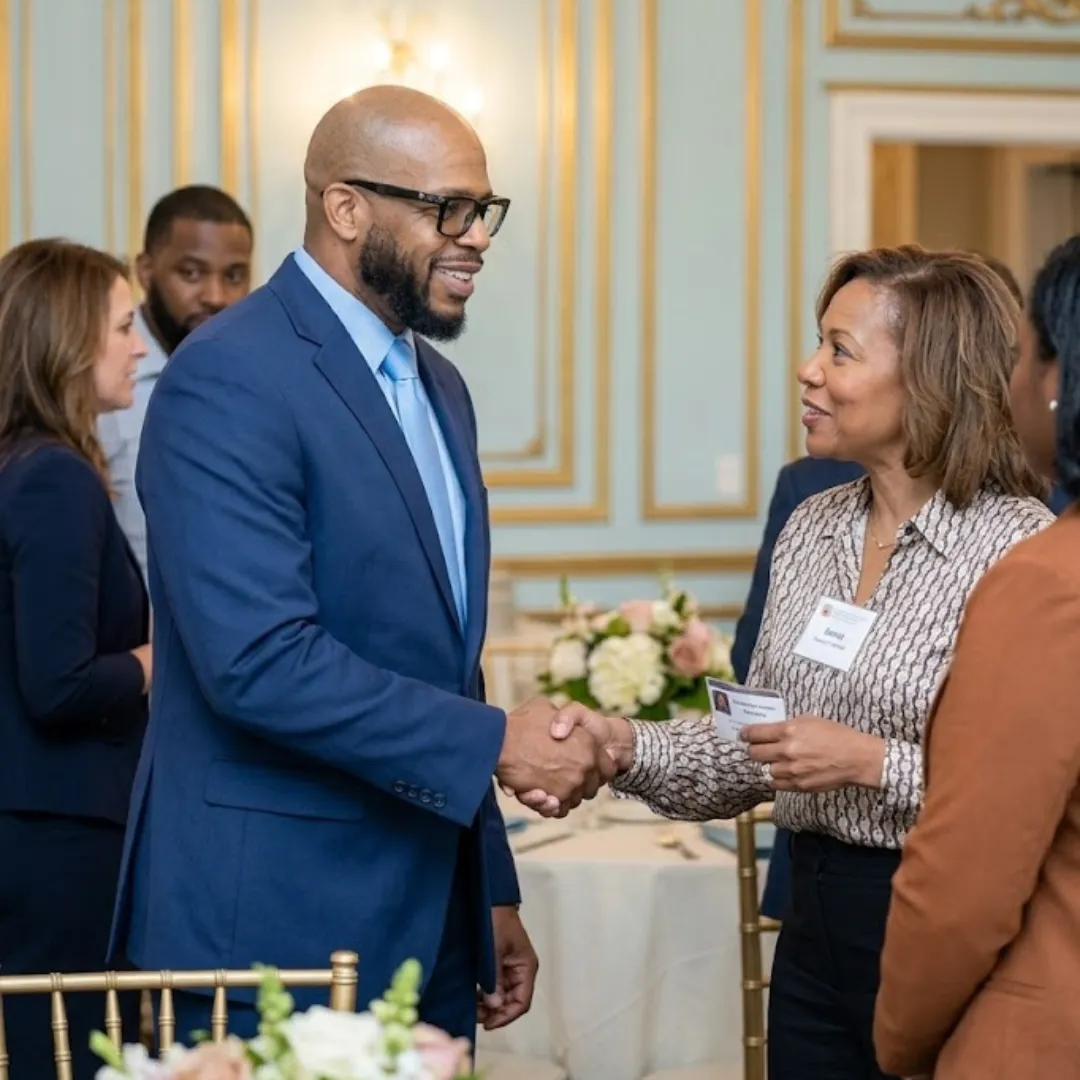 Dr. C. Victor Herbin III engaging with leaders at an event