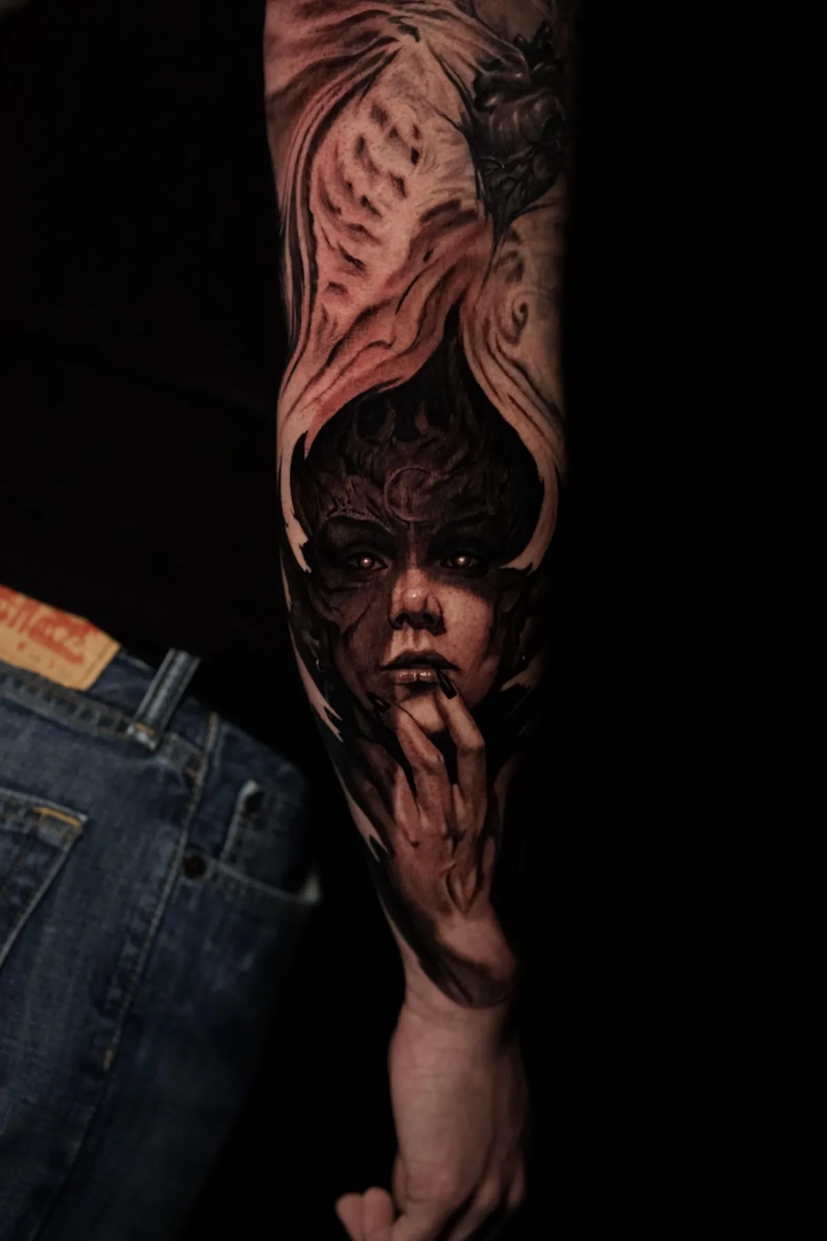 Black and grey dark fantasy portrait tattoo with horns, hand detail and dramatic realism by James Strickland in Missoula Montana