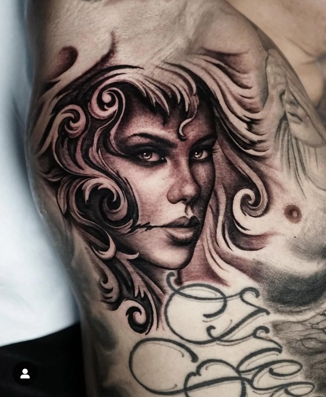 Black and grey female portrait tattoo with flowing ornamental hair and dark realism shading by James Strickland in Missoula Montana