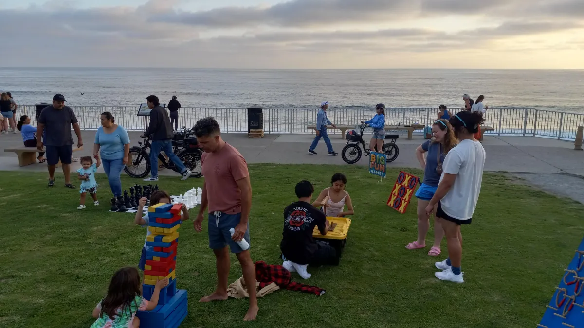 Games on lawn at sunset
