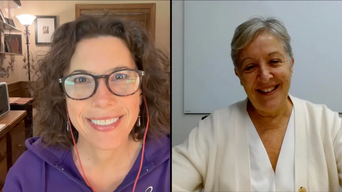 Susan and Kate smiling on a video call.