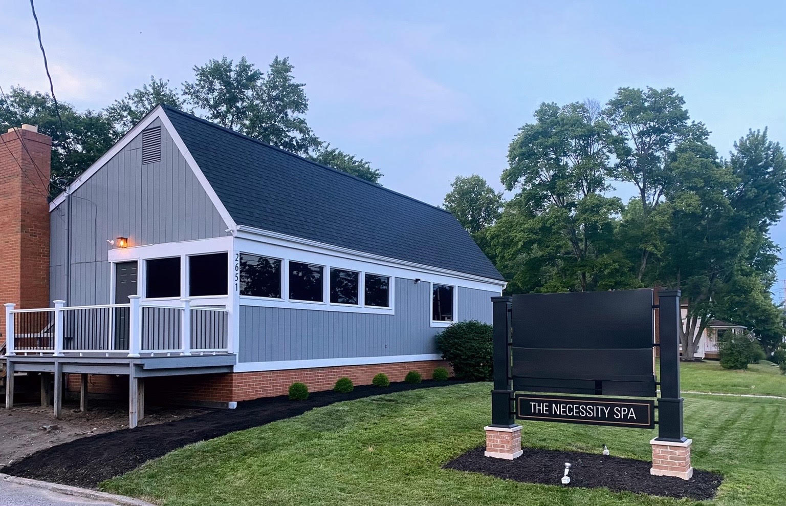 The Necessity Spa Building + Sign