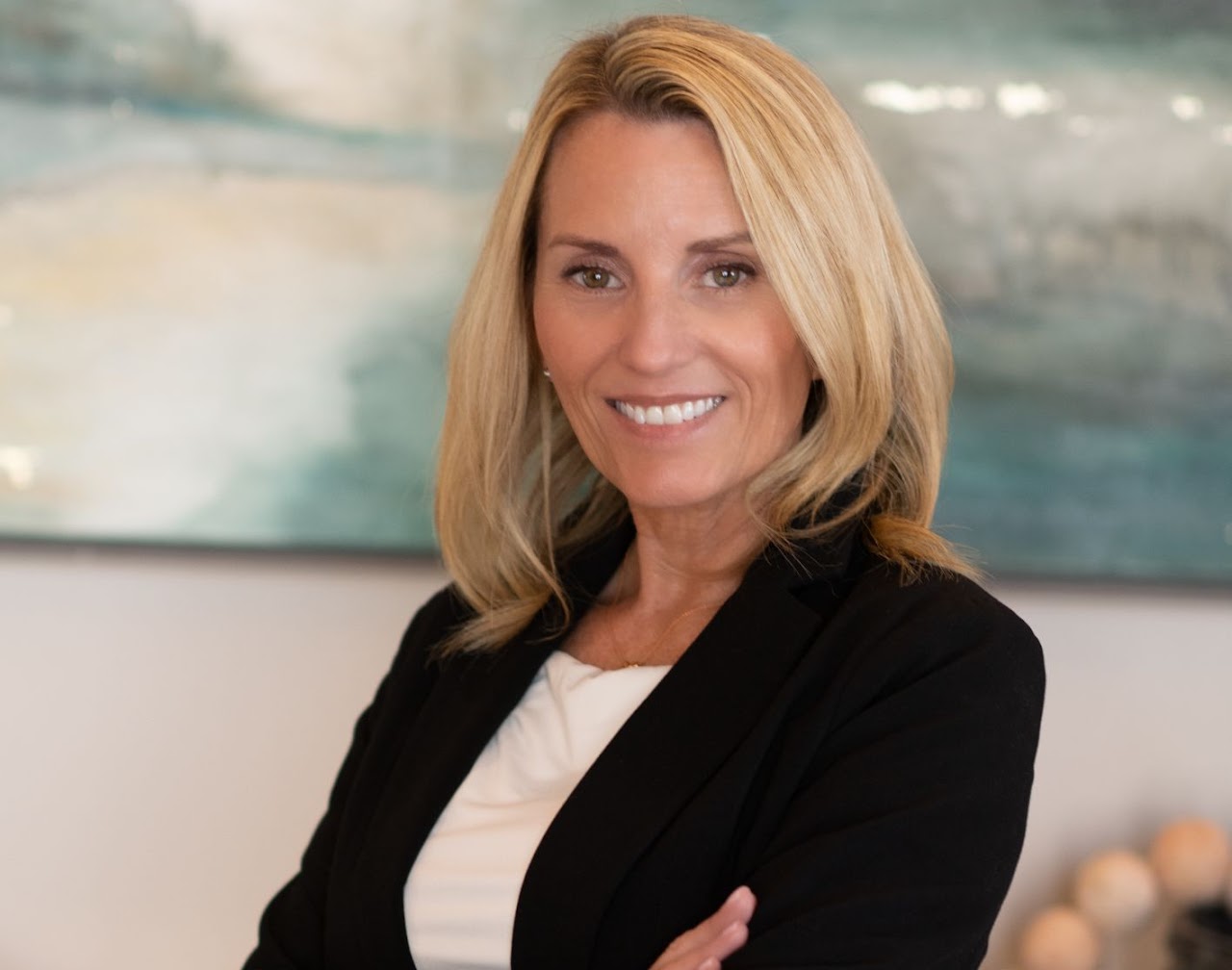 Smiling middle-aged couple outside their new home, candid and happy, testimonial photo