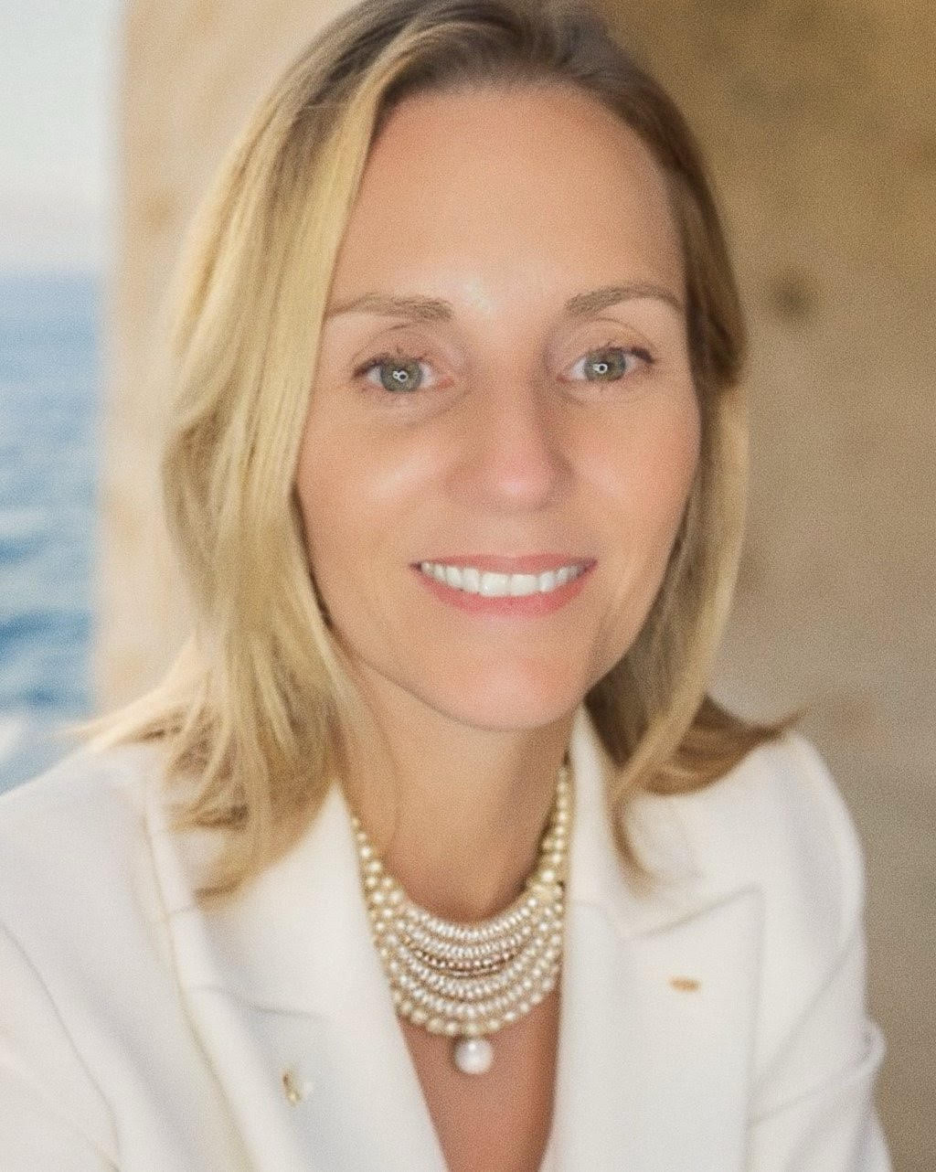 A welcoming suburban home exterior at dusk with warm interior lights, a family car in the driveway, soft natural sky tones, balanced composition and crisp depth — illustrating homeownership possibilities.