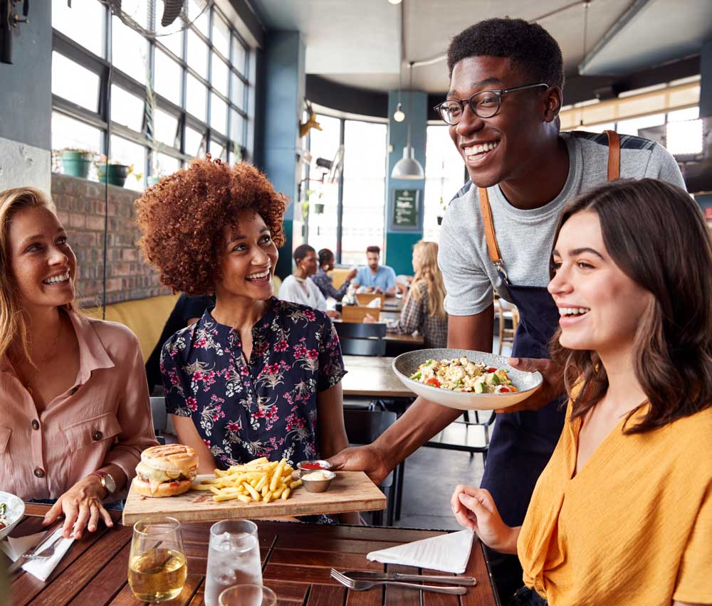 Busy restaurant owner looking stressed on the phone