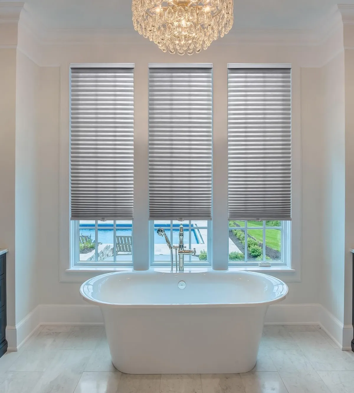 Designer roller shades installed in a modern Los Angeles bathroom