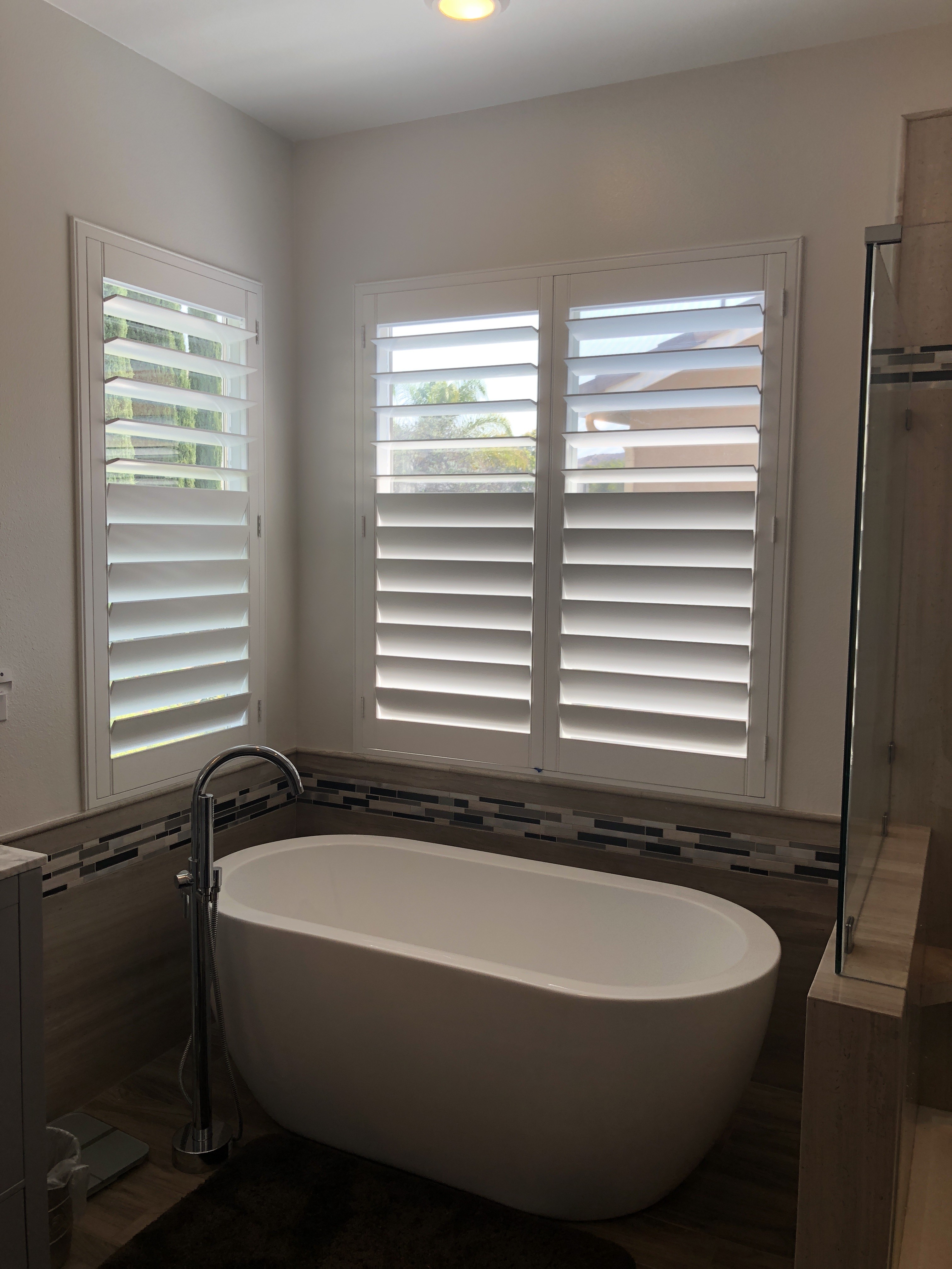 Plantation shutters in a luxury California bathroom