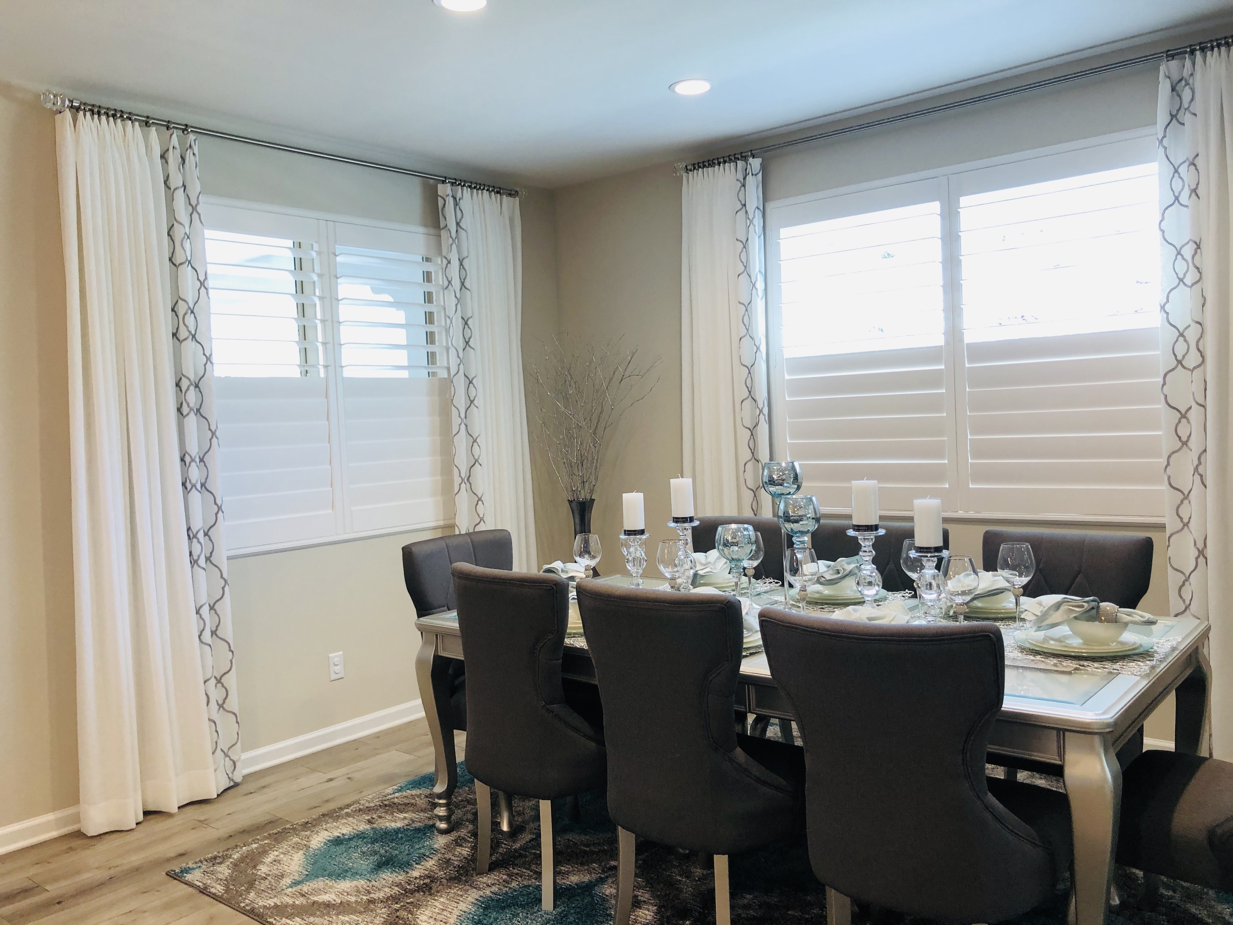 Plantation shutters and drapery in a Southern California dining room