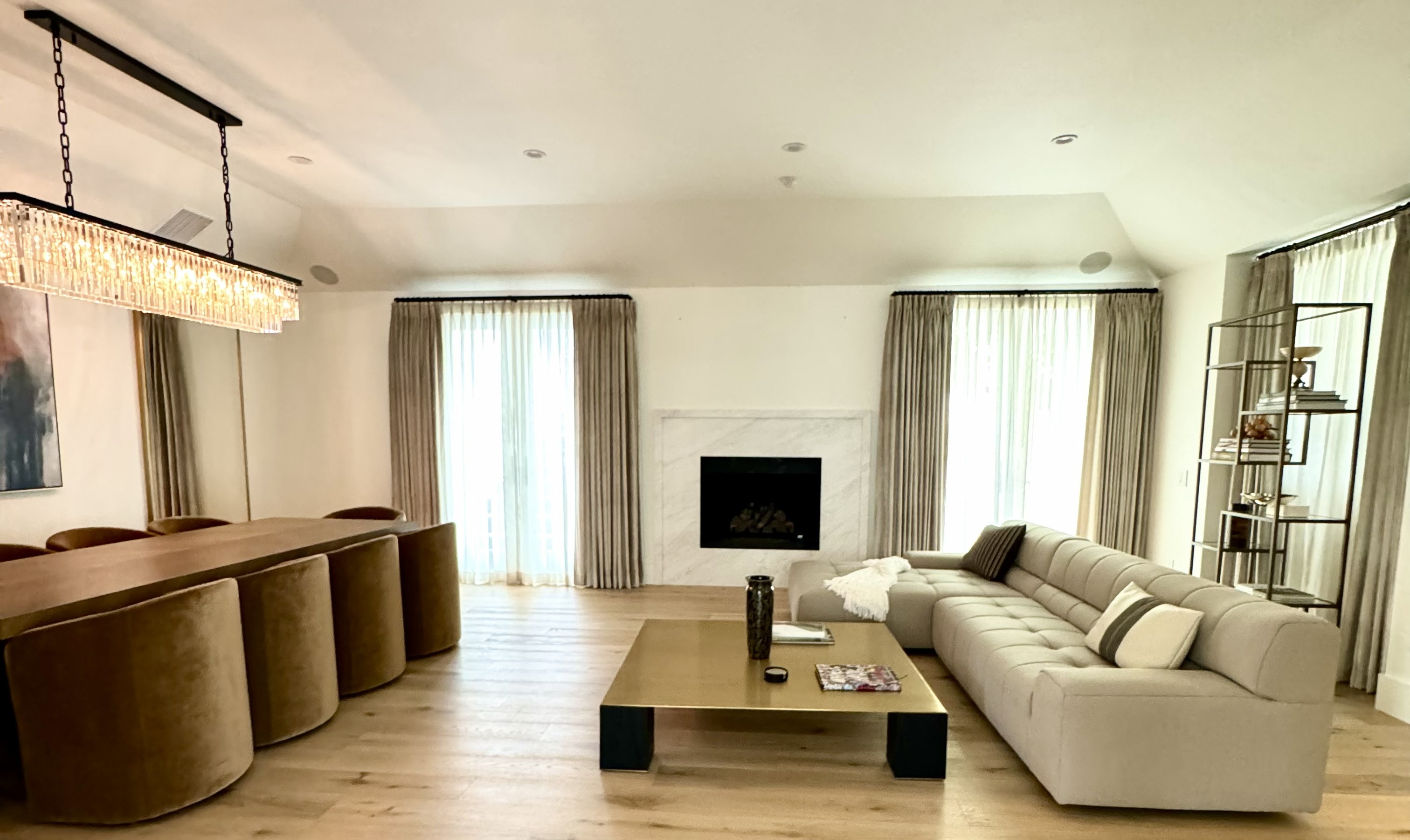 Luxury custom window treatments in a Thousand Oaks living room featuring designer drapery and sheer window coverings