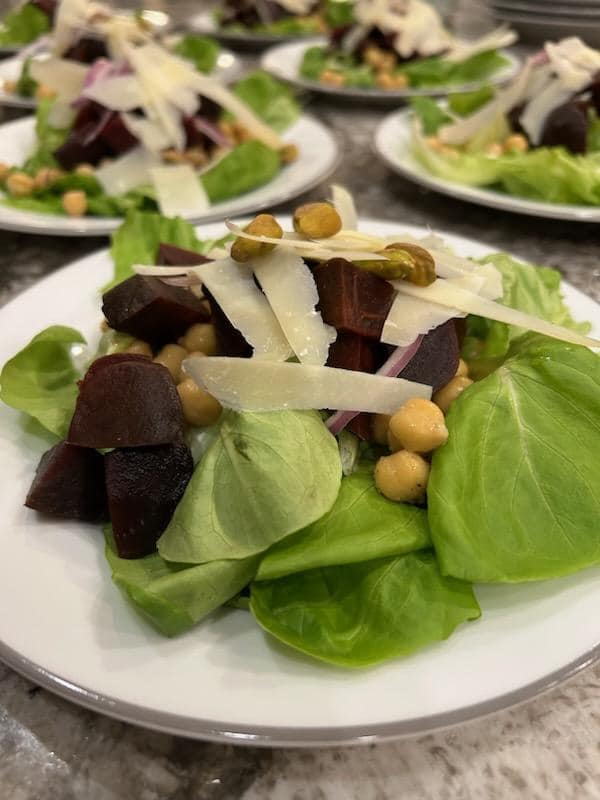 Fresh gourmet salad plated during a hands-on cooking class experience by Foodie Call private chef services