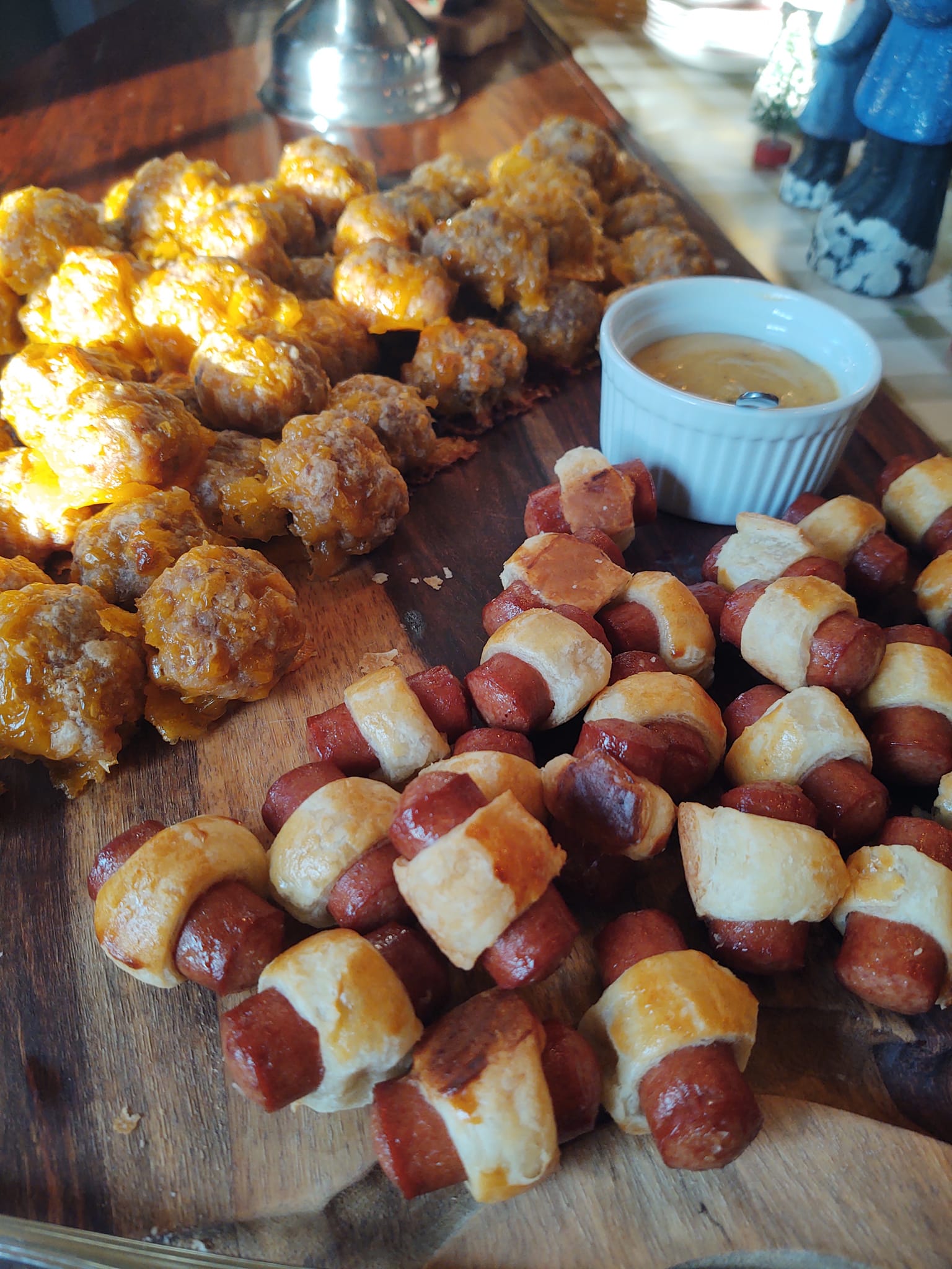Sweet and savory appetizer bites with dipping sauce prepared by Foodie Call catering