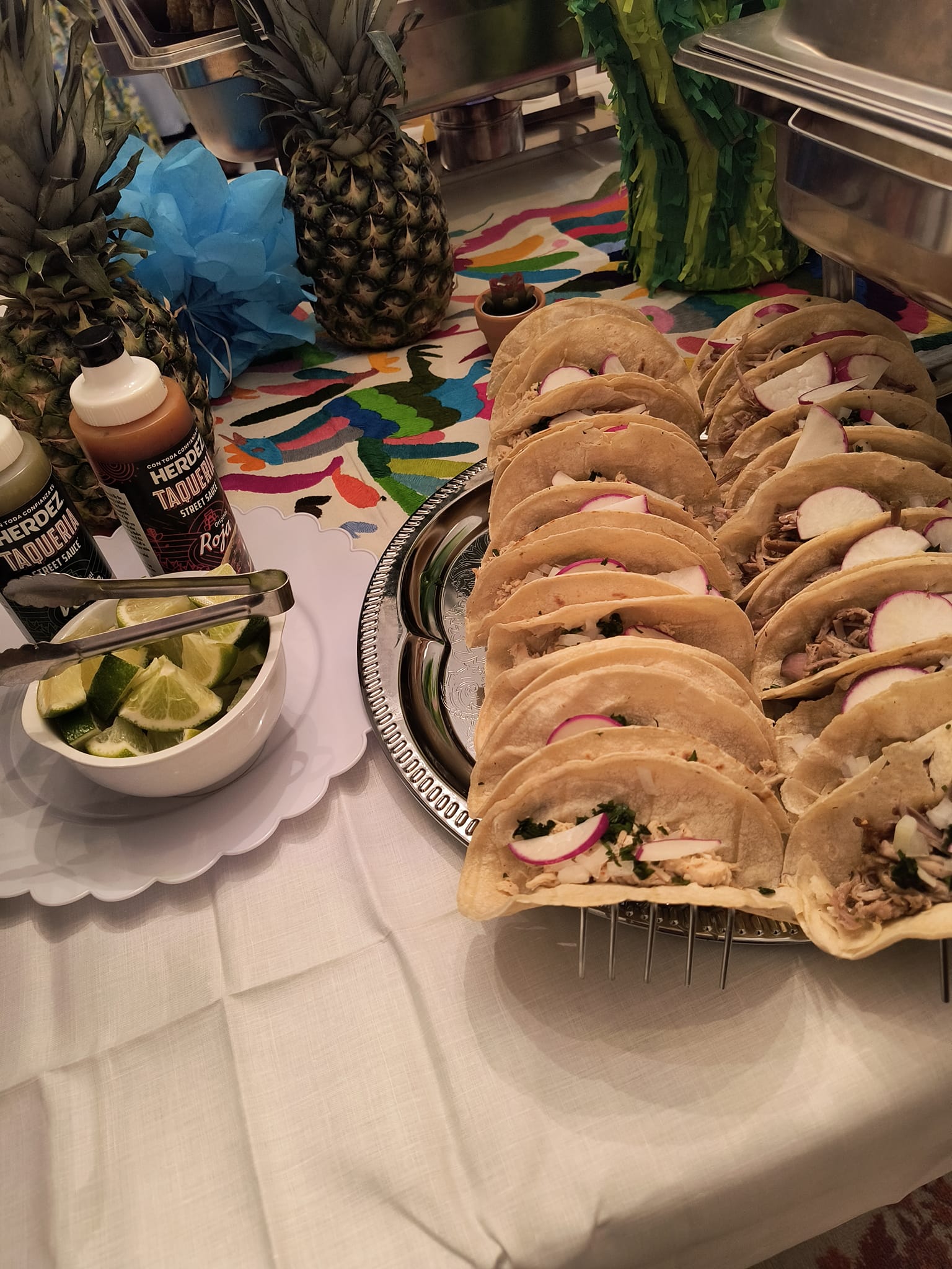 Soft shell tacos with fresh toppings served at a themed catering event by Foodie Call