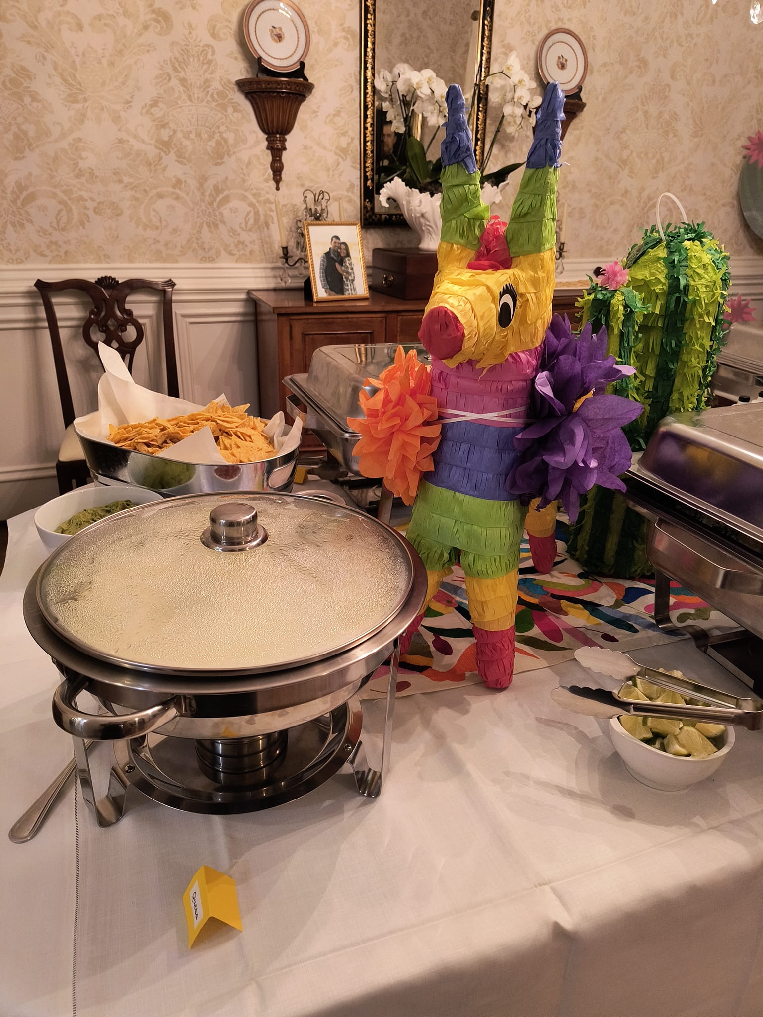 Elegant catering buffet station with festive décor prepared for a Foodie Call private event