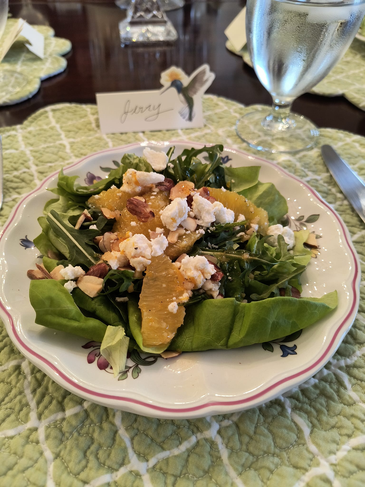 Fresh spinach and citrus salad served during a Foodie Call private dining experience