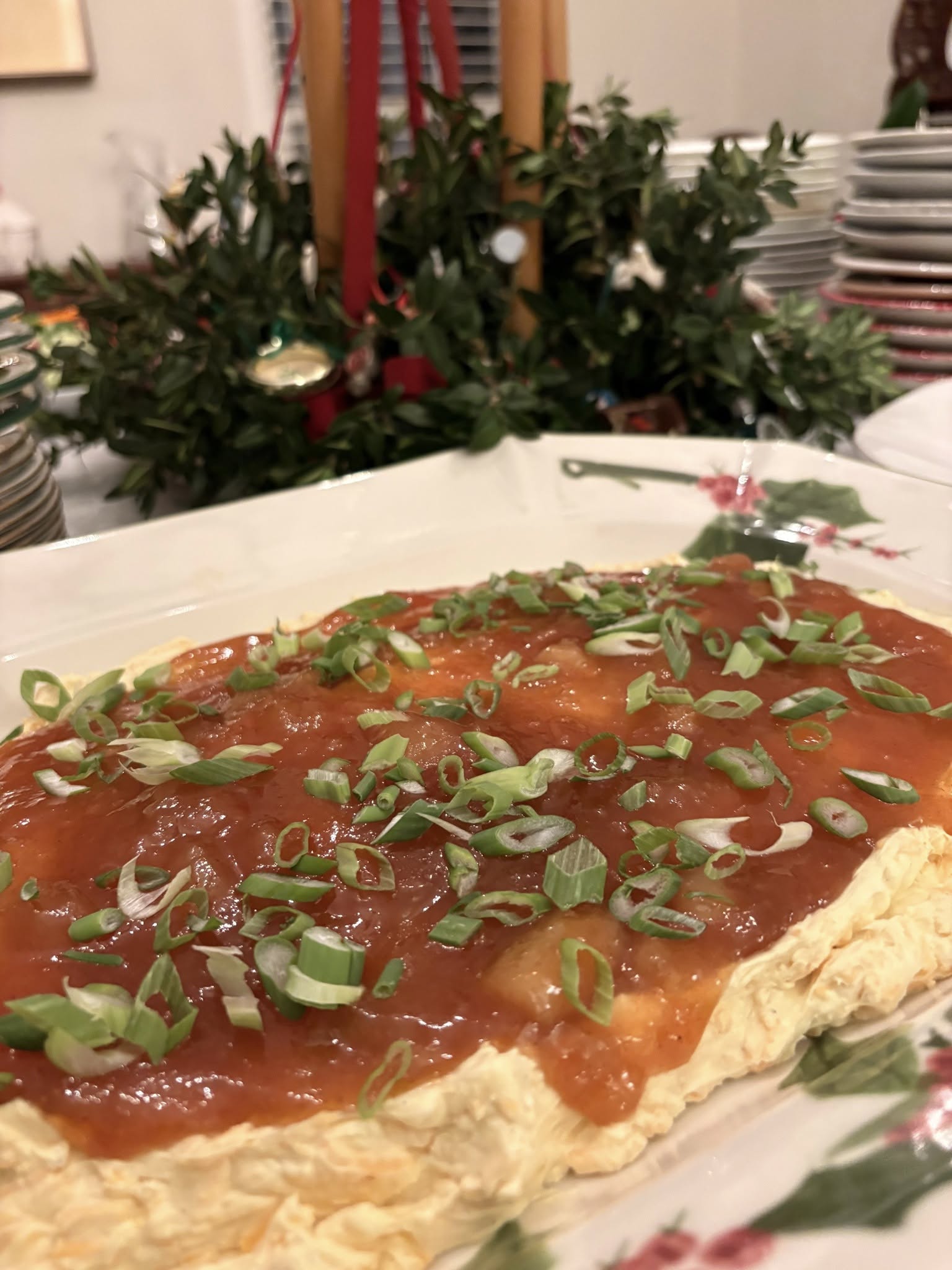 Savory brunch egg casserole topped with fresh herbs prepared by Foodie Call