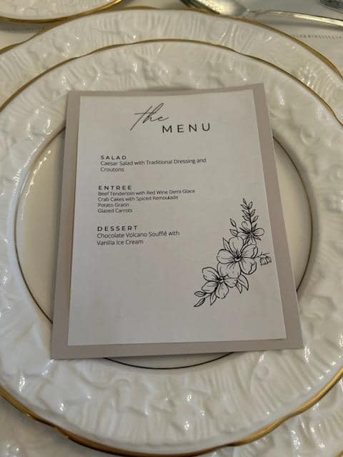 Elegant custom dinner menu setup on fine china tableware for a luxury private dining experience by Foodie Call