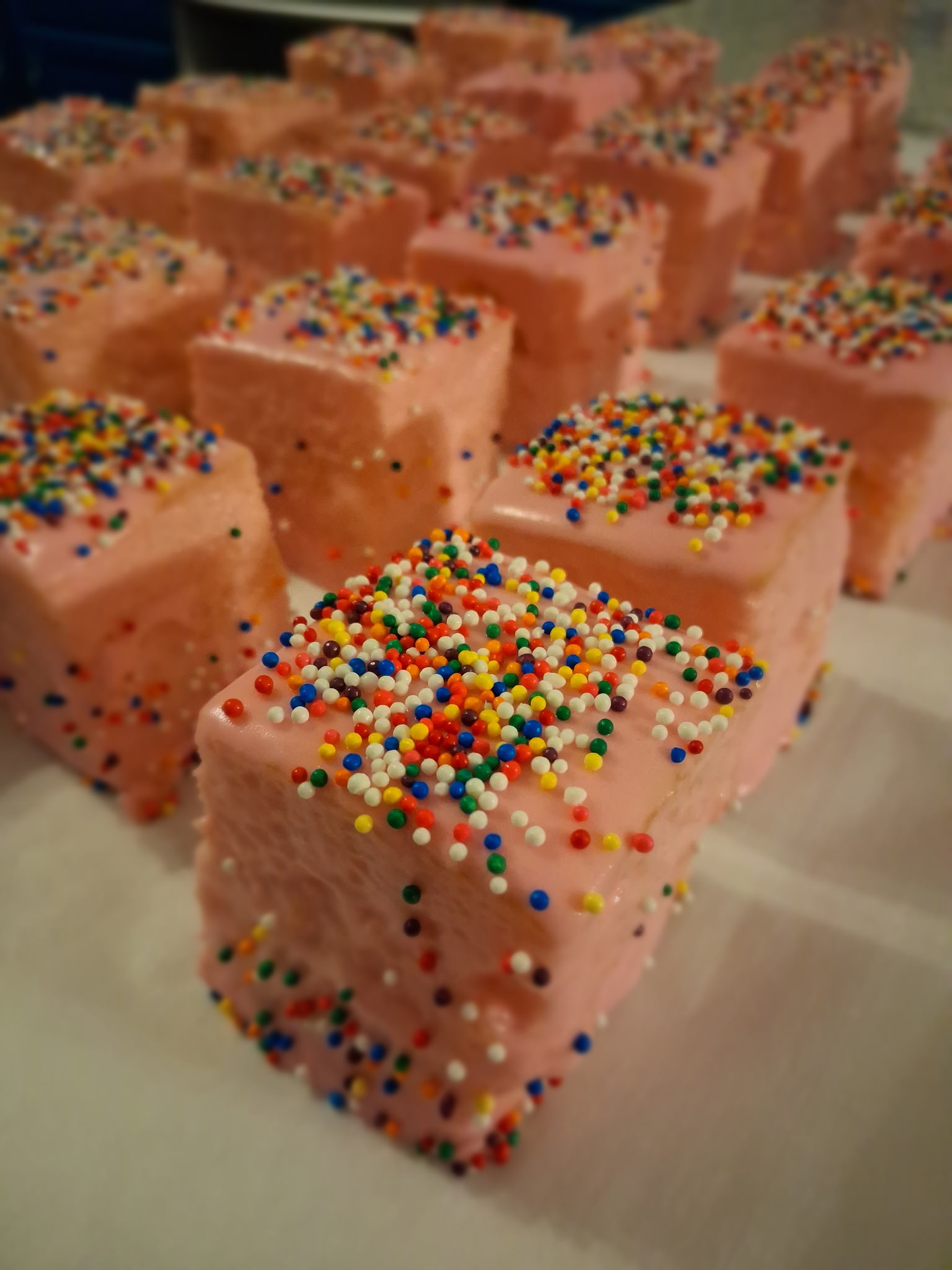 Colorful frosted dessert bites with rainbow sprinkles handcrafted for Foodie Call events and celebrations