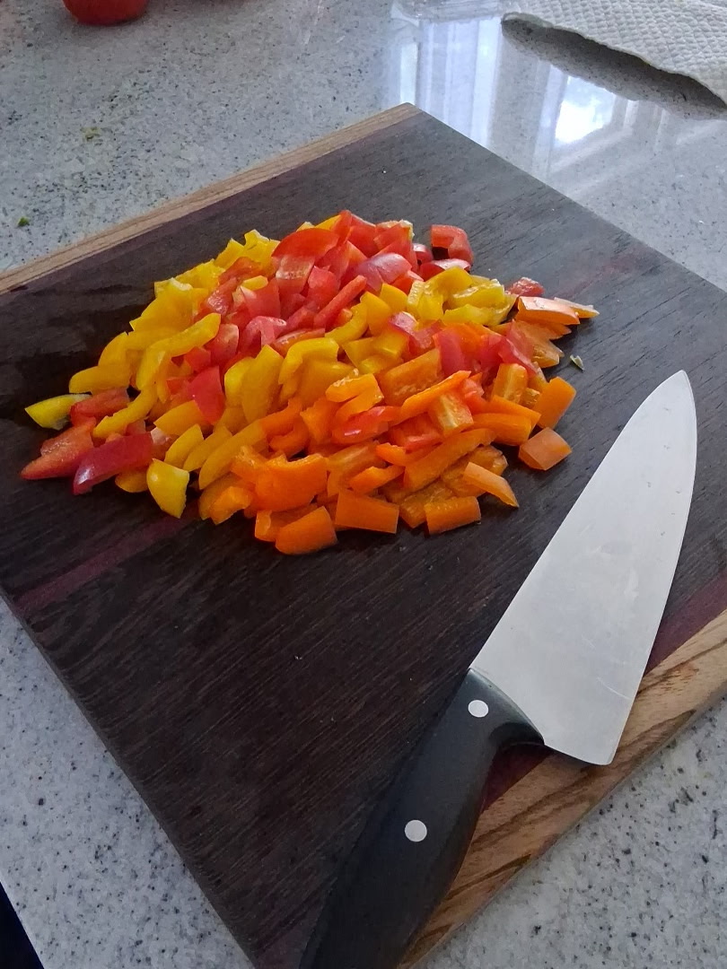 Fresh chopped bell peppers prepared for a cooking class and catering kitchen by Foodie Call