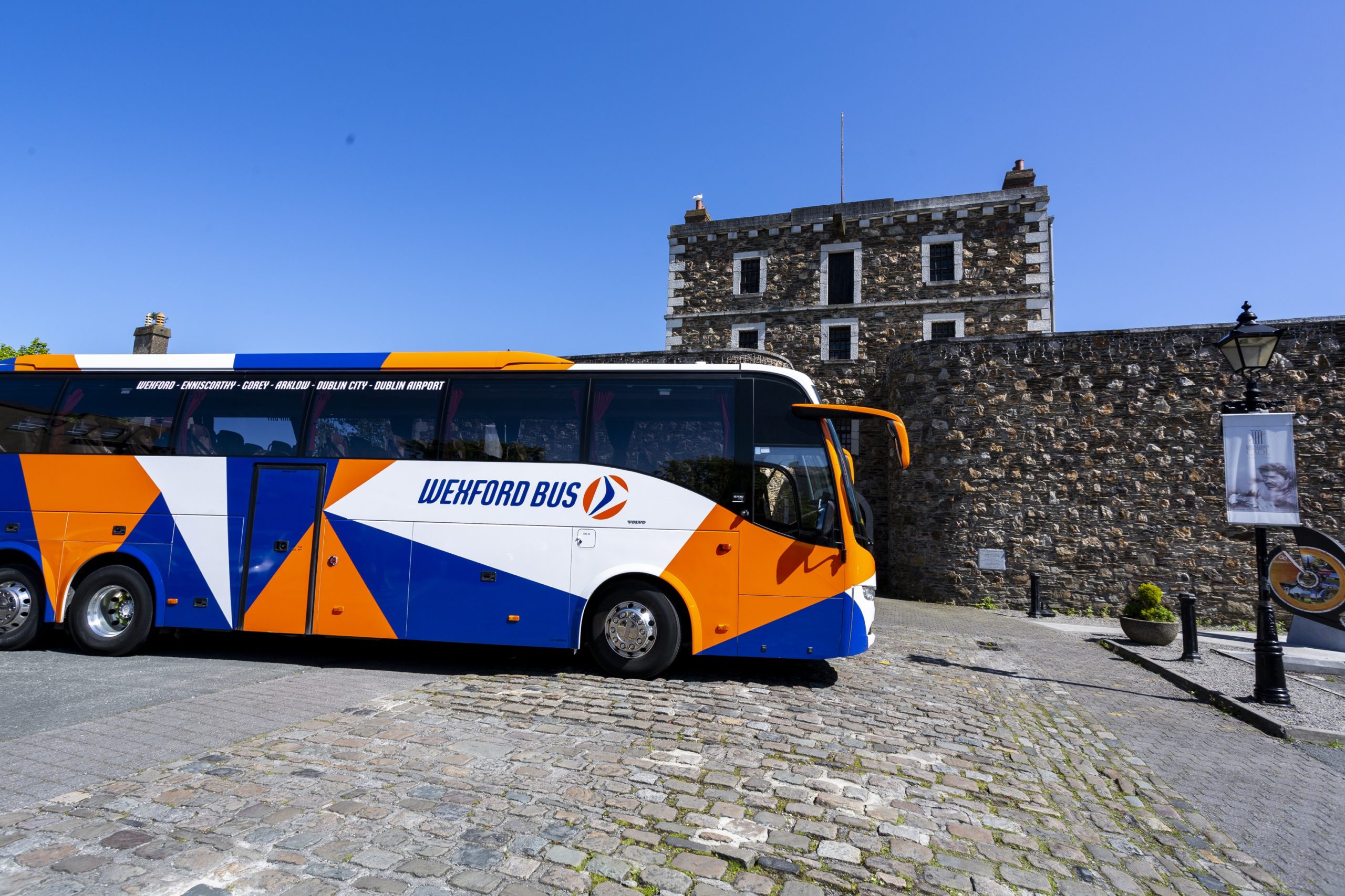 Festive table setting illuminated with blue lights.