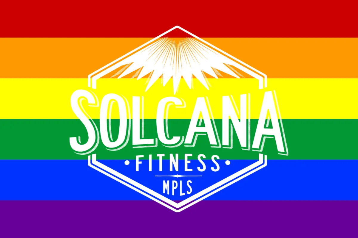 Solcana fitness logo in front of a rainbow Pride flag.
