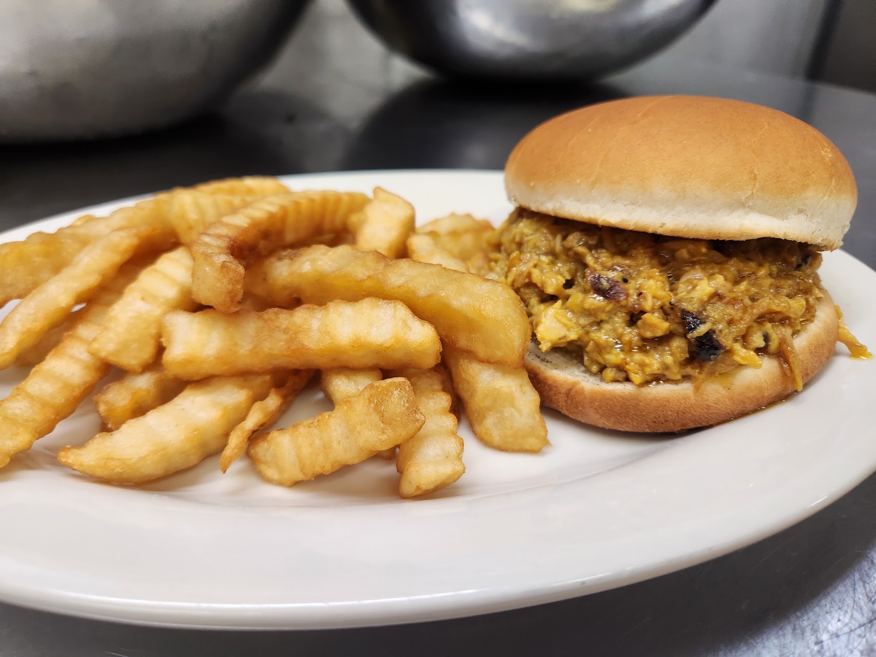 Pulled pork sandwich with crinkle fries at MiMi’s Place