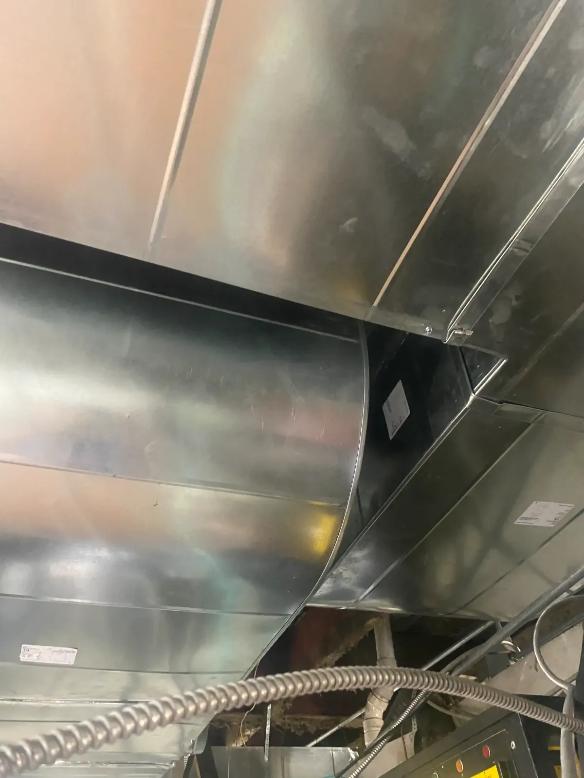 Modern commercial refrigeration unit with glass doors showing fresh produce in a sleek clean food service facility in Weatherford TX