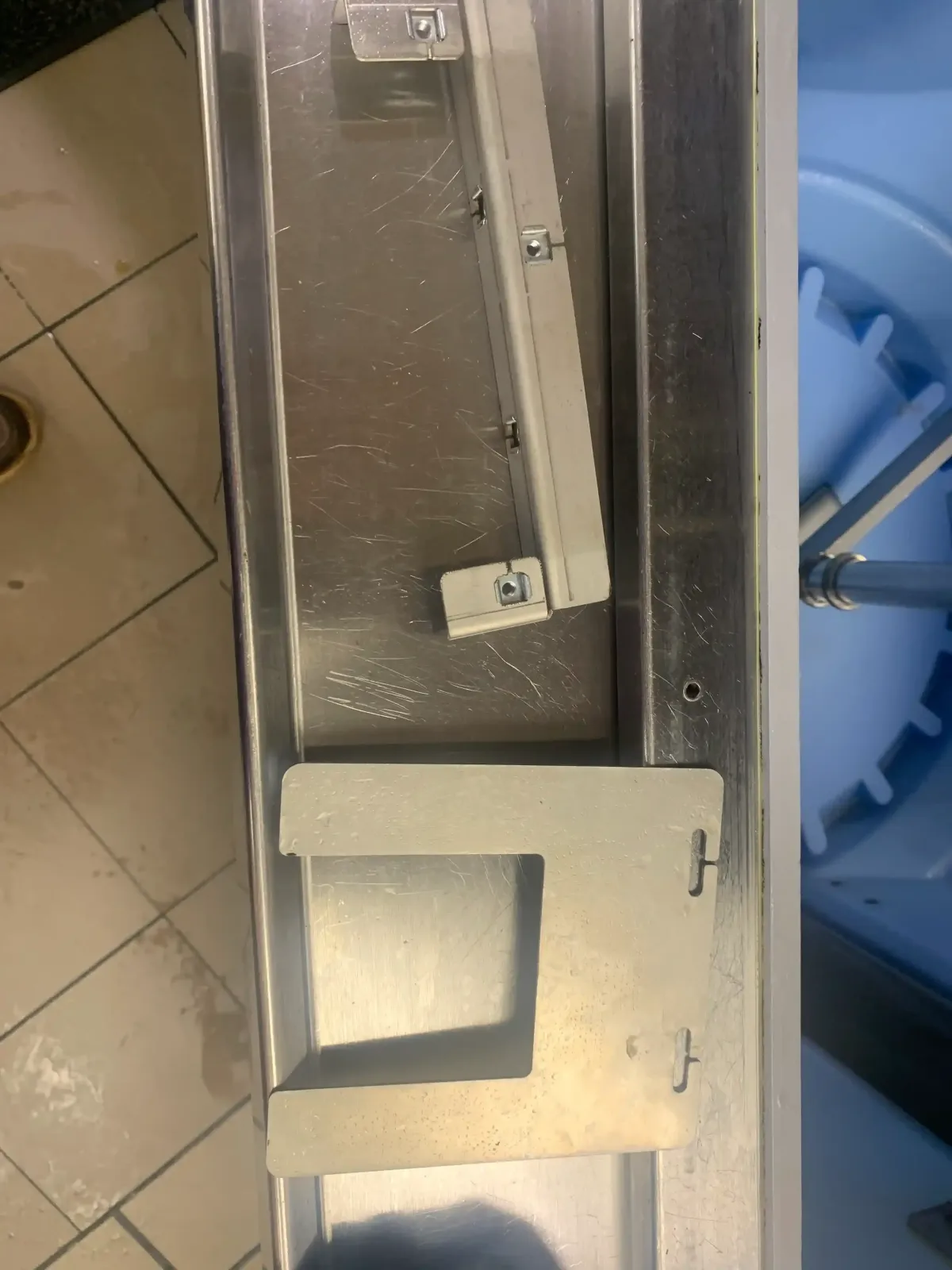Commercial refrigeration repair scene in Weatherford TX with modern unit, sleek metallic surfaces, glass doors, and organized tools