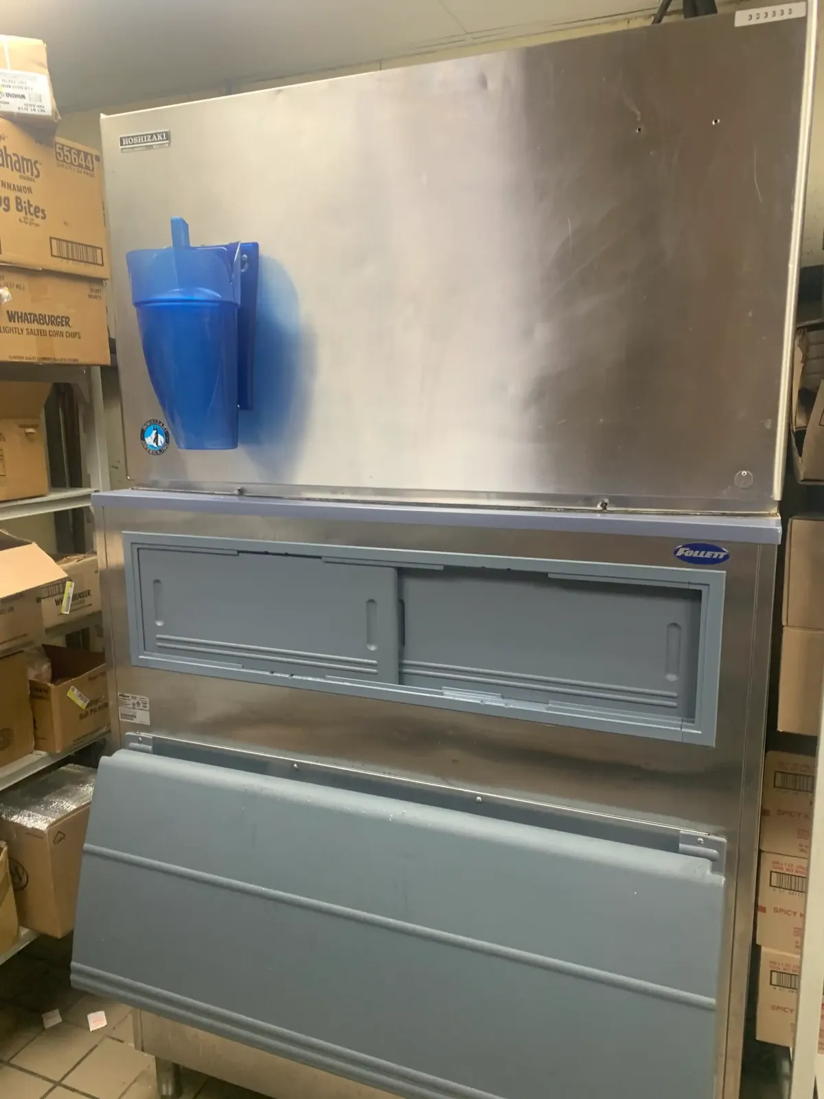 Modern stainless steel commercial refrigeration unit displaying fresh produce in a clean, well-lit food storage facility in Weatherford TX