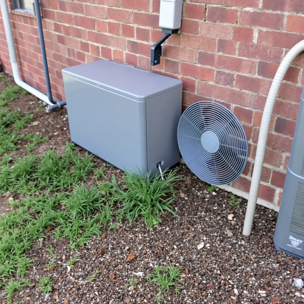 Detailed view of a modern HVAC system installed in Blue Mound, TX, showcasing its components and setup.