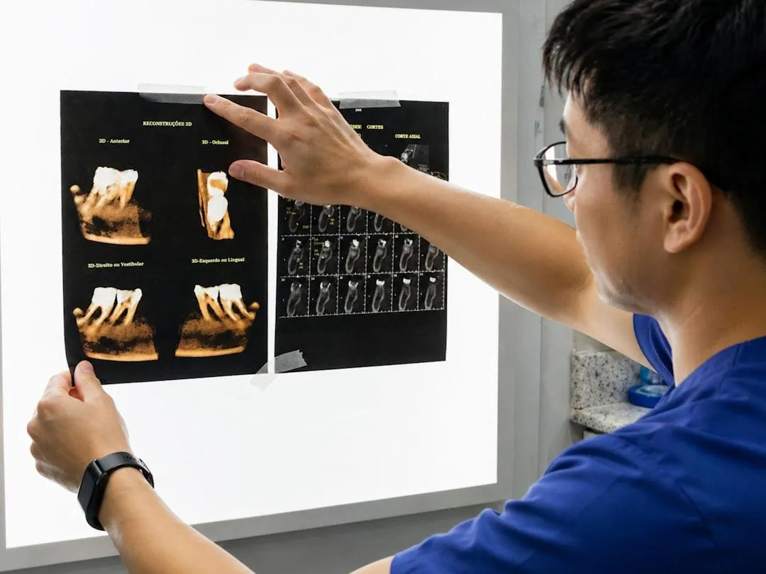 Dental team reviewing 3D CT scan for implant planning