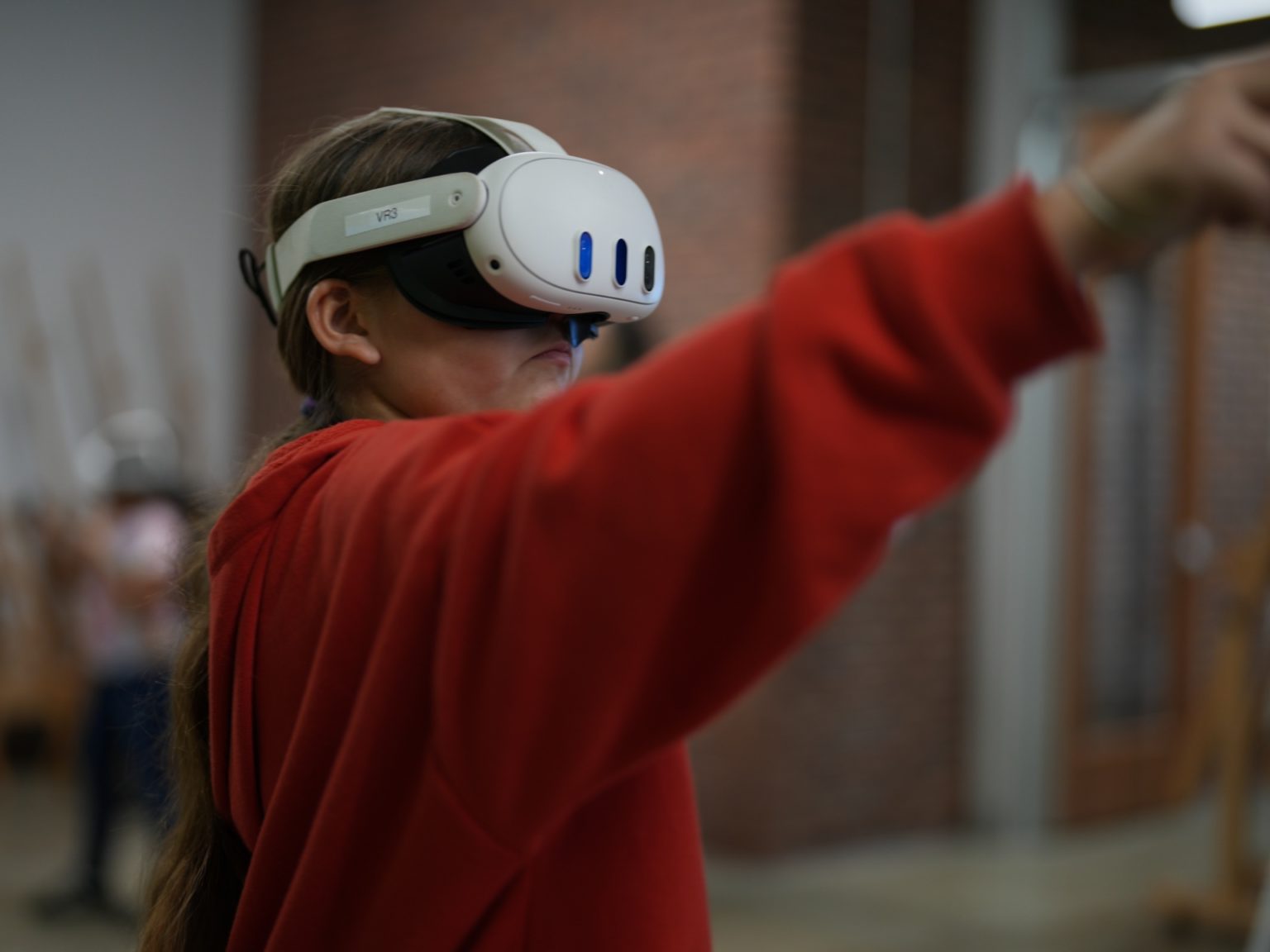 a group of people sitting around a table working on a project