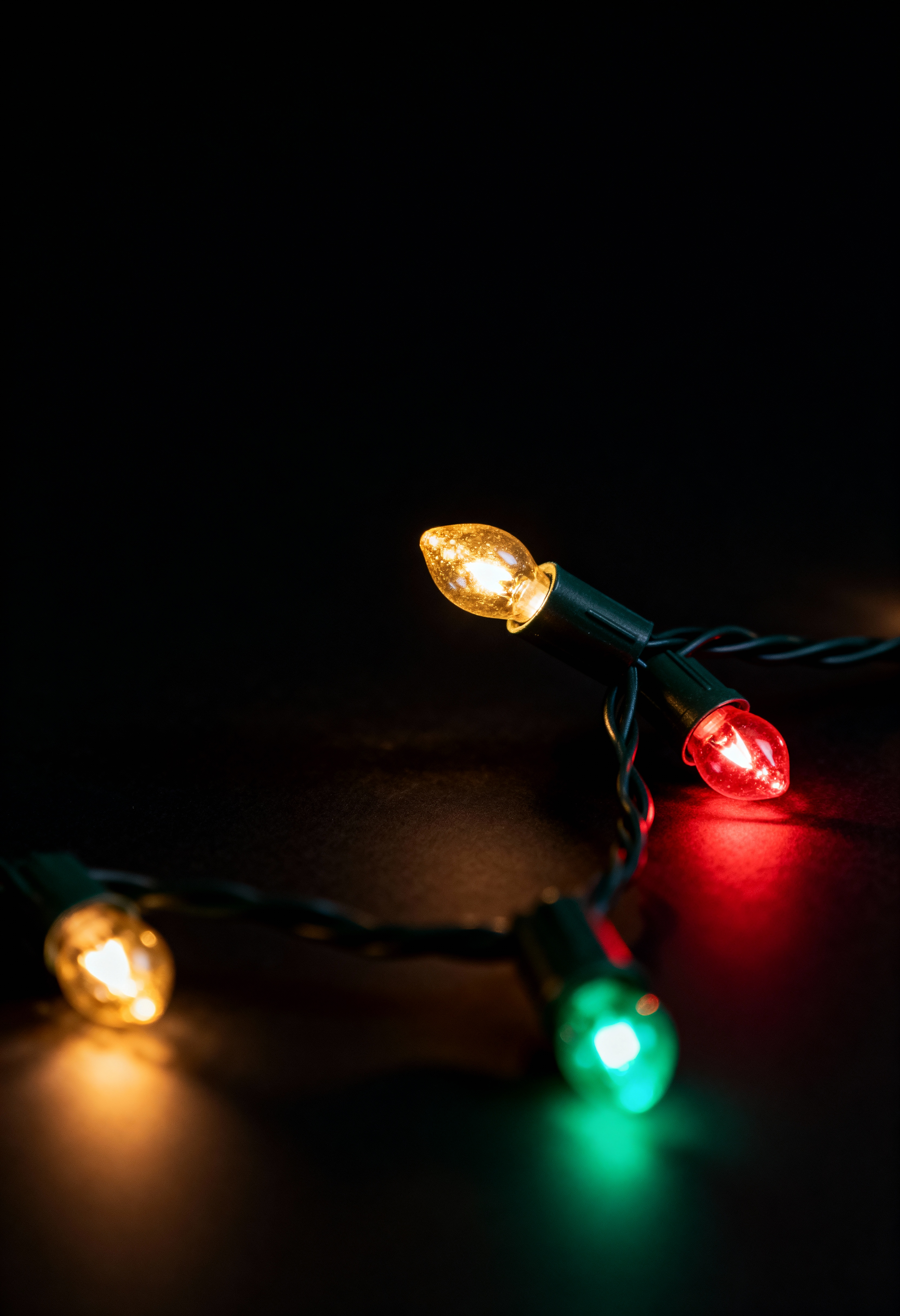 a bed sitting under a window next to a night stand