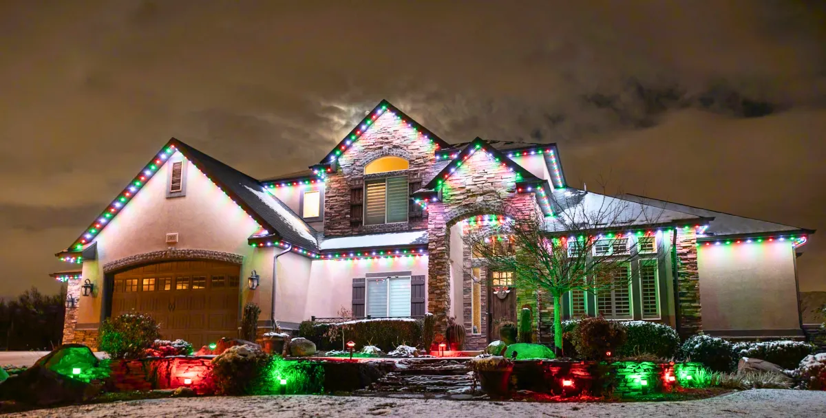 a bed sitting under a window next to a night stand
