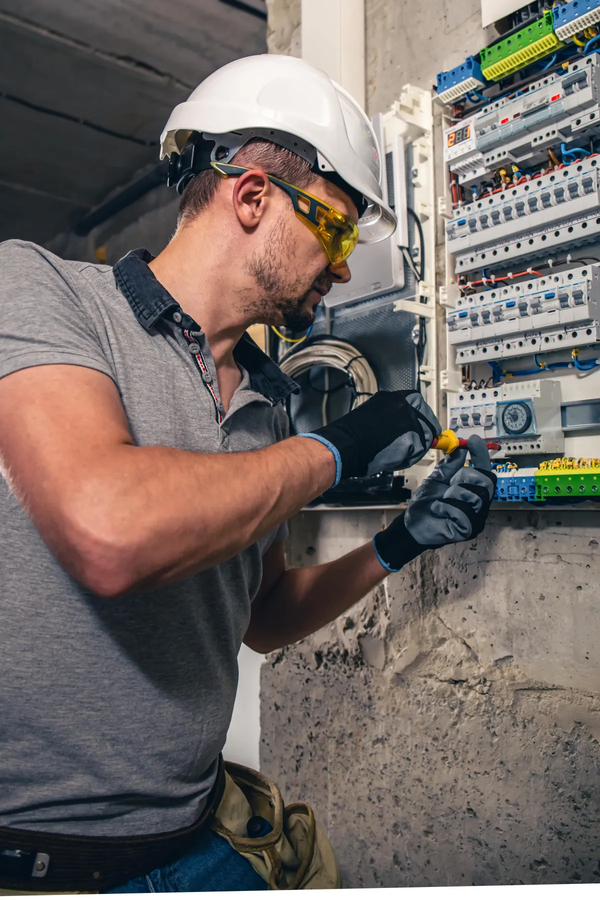 Emergency Electrician fixing a fuse board, Safe Sark Solutions